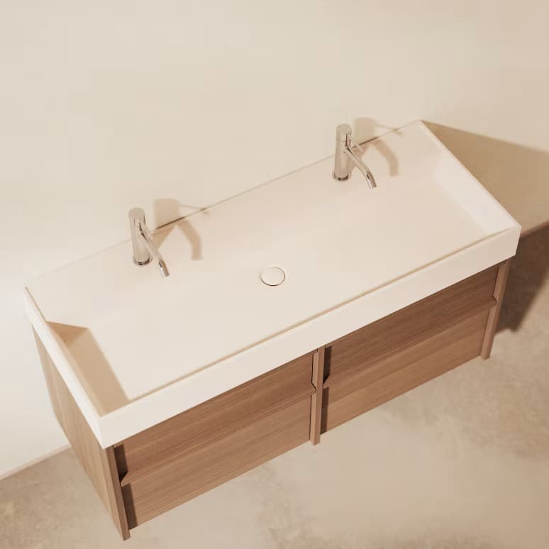 A modern, wall-mounted double sink bathroom vanity featuring a light wood cabinet with four drawers and a seamless white integrated countertop and sinks. Two chrome single-lever faucets are installed. — 3D model