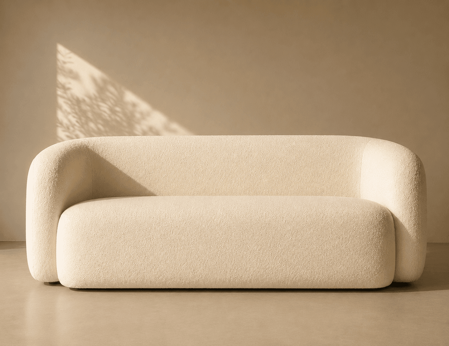 A contemporary loveseat upholstered in off-white bouclé fabric, featuring a distinctive rounded silhouette with integrated arms and backrest, and a concealed base. — 3D model