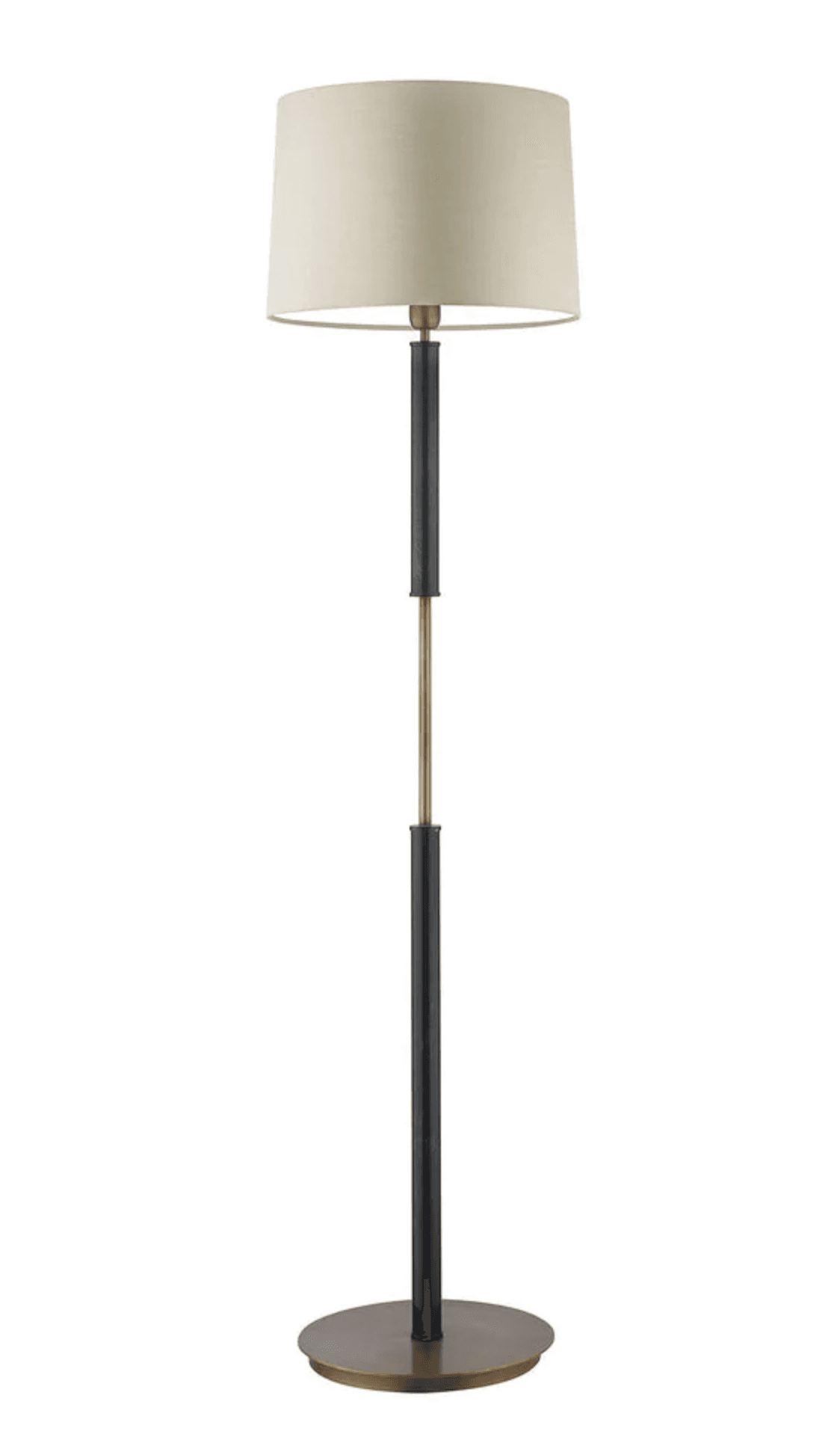 A contemporary floor lamp featuring a two-tone design. The lamp has a circular, flat brass base. The central column is composed of cylindrical segments, alternating between a matte black finish and polished brass, creating a distinctive visual contrast. The column supports a simple, cylindrical drum shade made of a light, neutral-colored fabric, likely beige or cream. The overall aesthetic is clean and modern. — 3D model