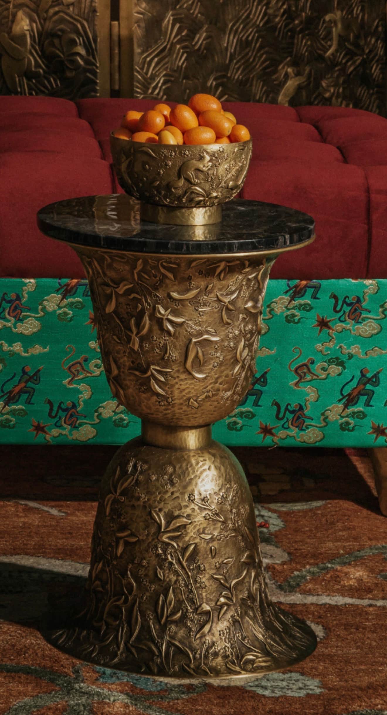 A highly ornate pedestal-style side table featuring a dark, polished black marble tabletop. The base… — 3D model