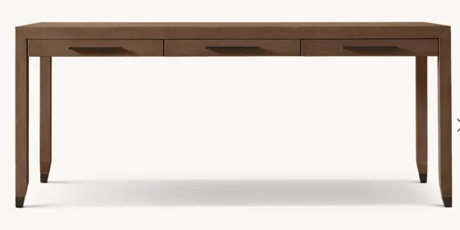 A rectangular console desk featuring three integrated drawers, all encased in a textured brown mater… — 3D model