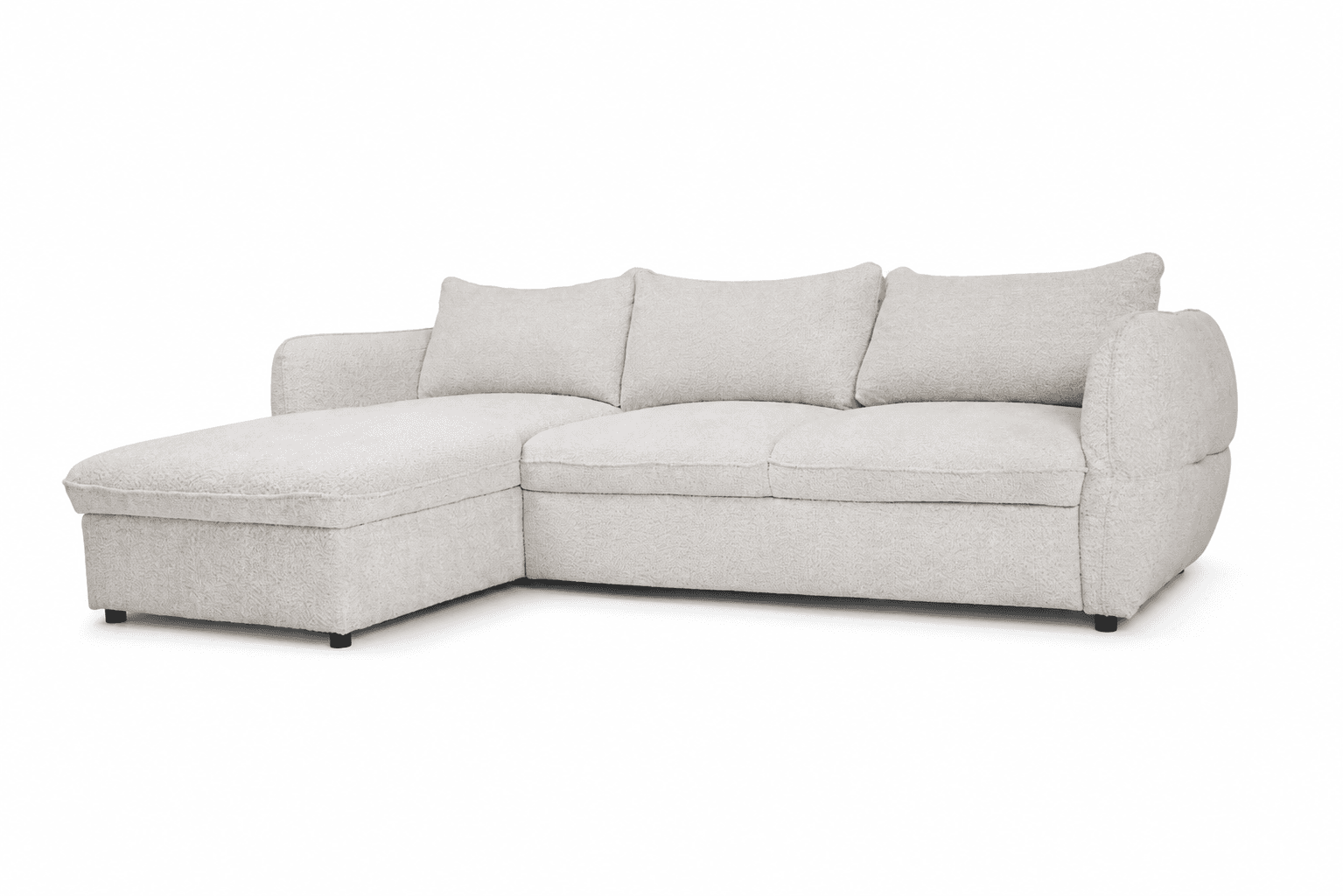 An L-shaped sectional sofa upholstered in a light beige or cream boucle fabric, featuring a left-hand chaise. The sofa has a low-profile design with subtly rounded armrests and back cushions. It includes multiple back cushions and thick, firm-looking seat cushions, all covered in the same textured fabric. The legs are small, dark, and set back, giving the impression of a floating base. The overall aesthetic is modern, plush, and inviting. — 3D model