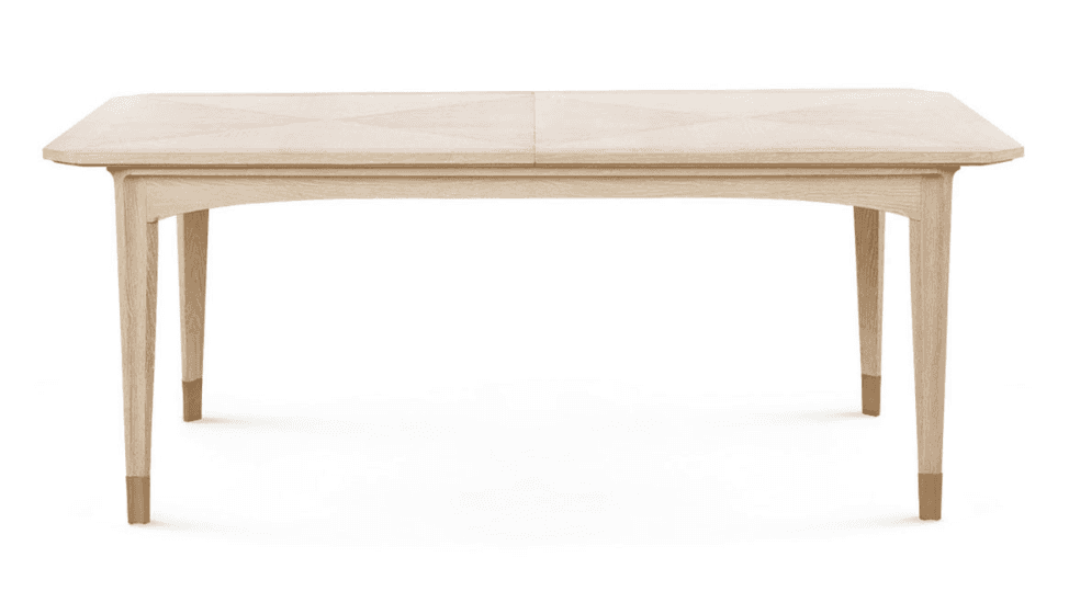 A contemporary rectangular dining table made of light-toned wood, featuring a multi-panel top with a… — 3D model
