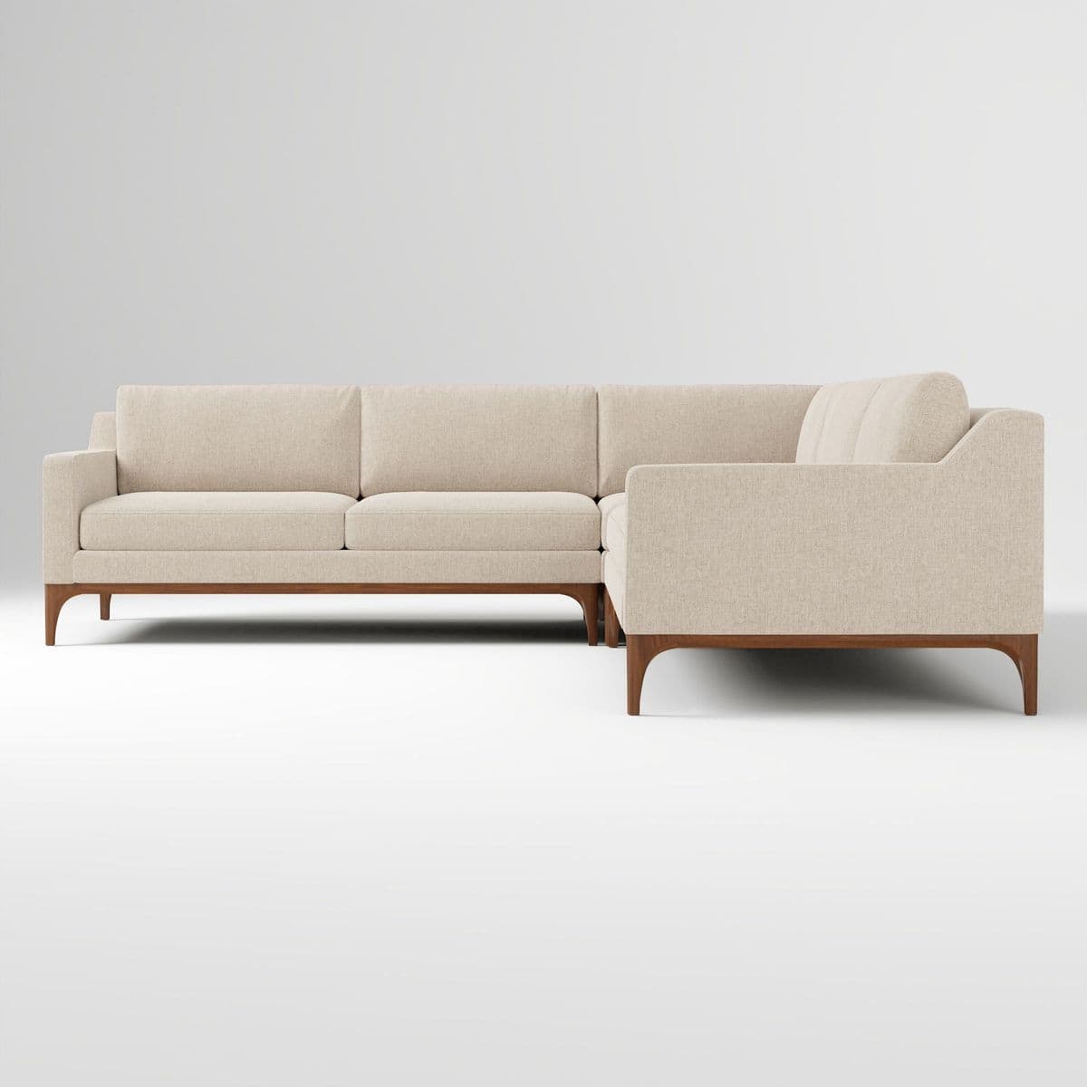 An L-shaped sectional sofa featuring light-colored fabric upholstery and an exposed dark wood base with tapered legs. The design is modern and minimalist, composed of multiple upholstered sections. — 3D model