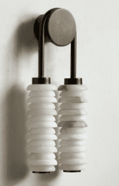 A wall-mounted lamp with a dual cylindrical shade design. The fixture features a brushed metallic fi… — 3D model