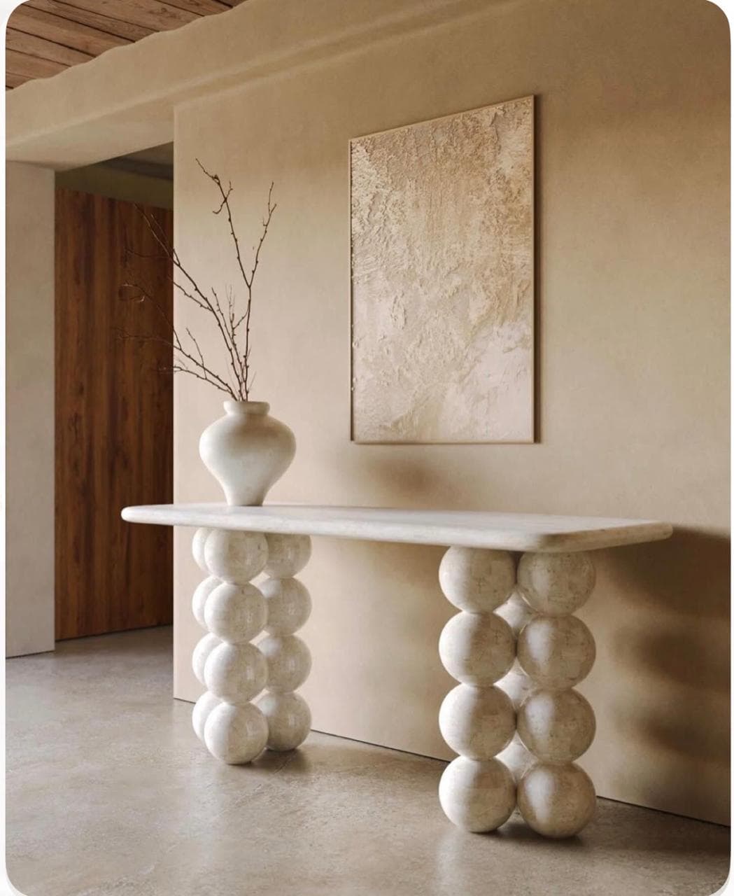 A white, rectangular bench featuring a solid top with rounded edges, supported by two bases each composed of three large, stacked spherical elements. The material appears to be a light-colored, textured stone or stone composite. — 3D model