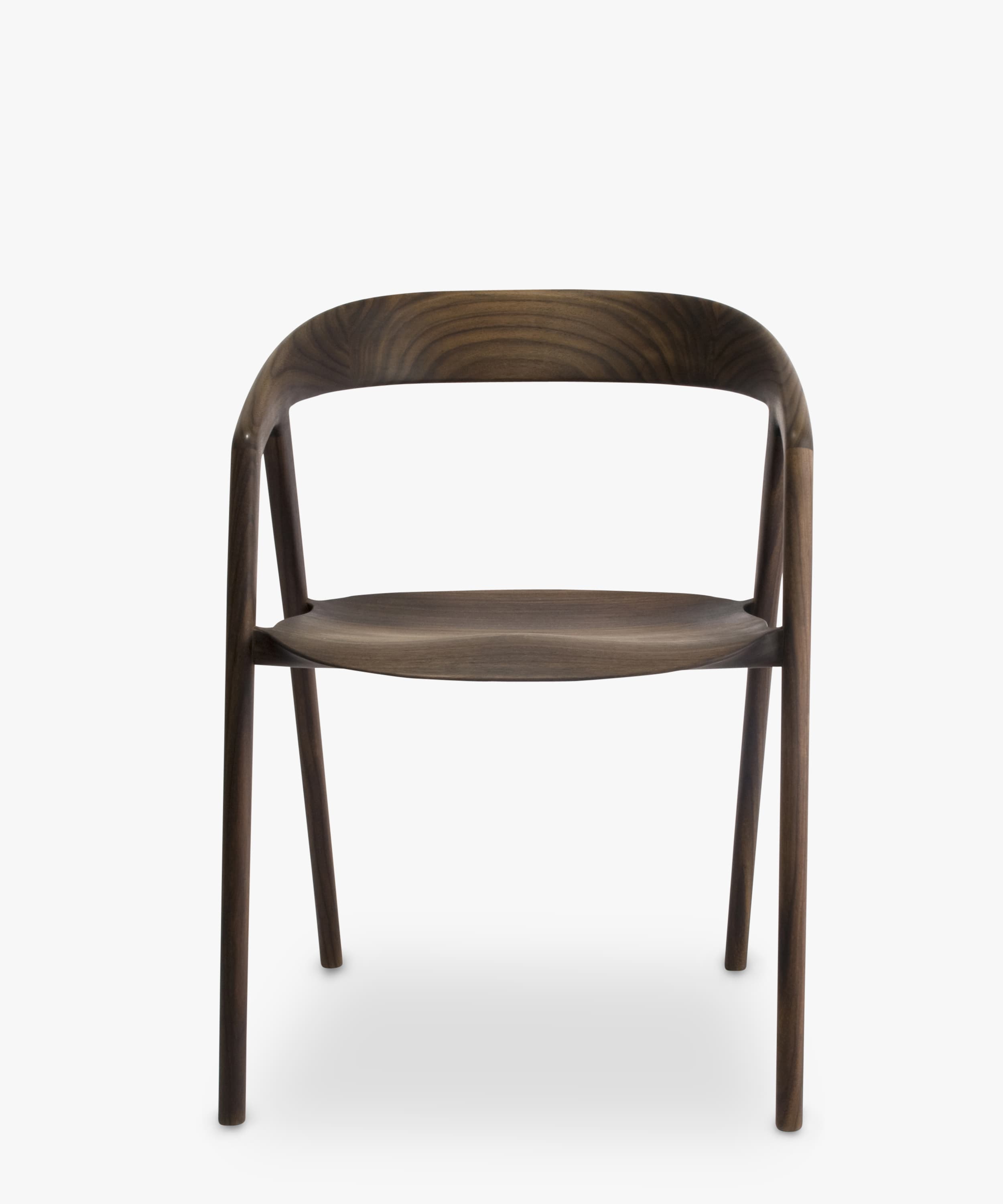 A contemporary armless chair crafted from dark walnut wood, featuring a curved backrest and a subtly sculpted seat, supported by four slender, round legs. — 3D model