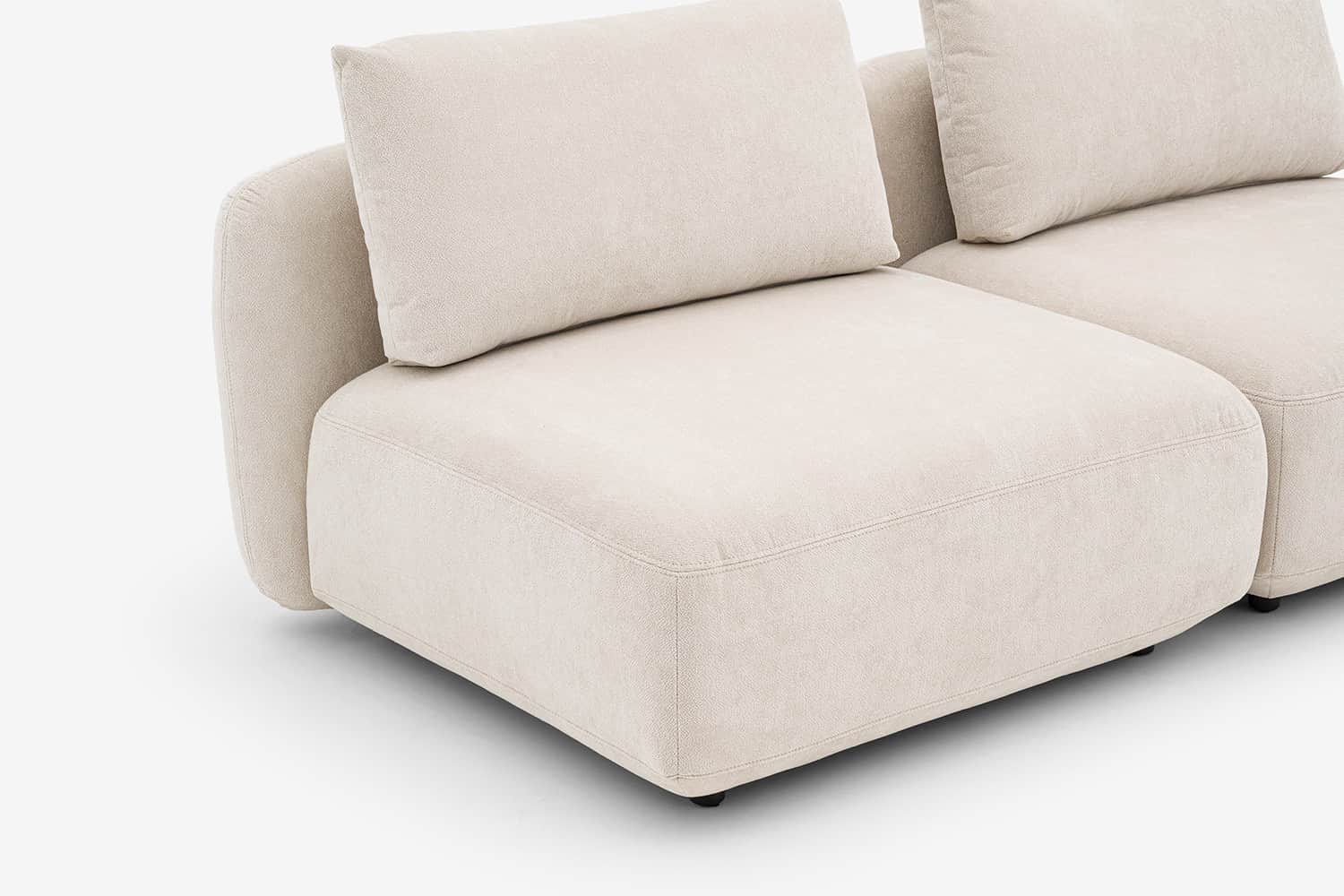 A sectional sofa unit with a low profile, upholstered in a textured, light-colored fabric. The desig… — 3D model