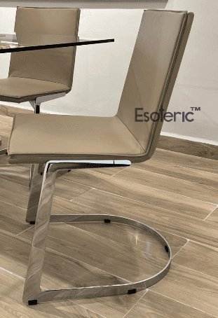 A modern dining chair with a sleek design. The seat and backrest are upholstered in a light beige ma… — free GLB 3D model
