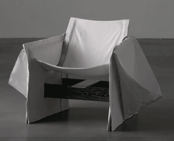 A contemporary lounge chair featuring a dark-stained slatted wooden frame over which a light grey fa… — 3D model