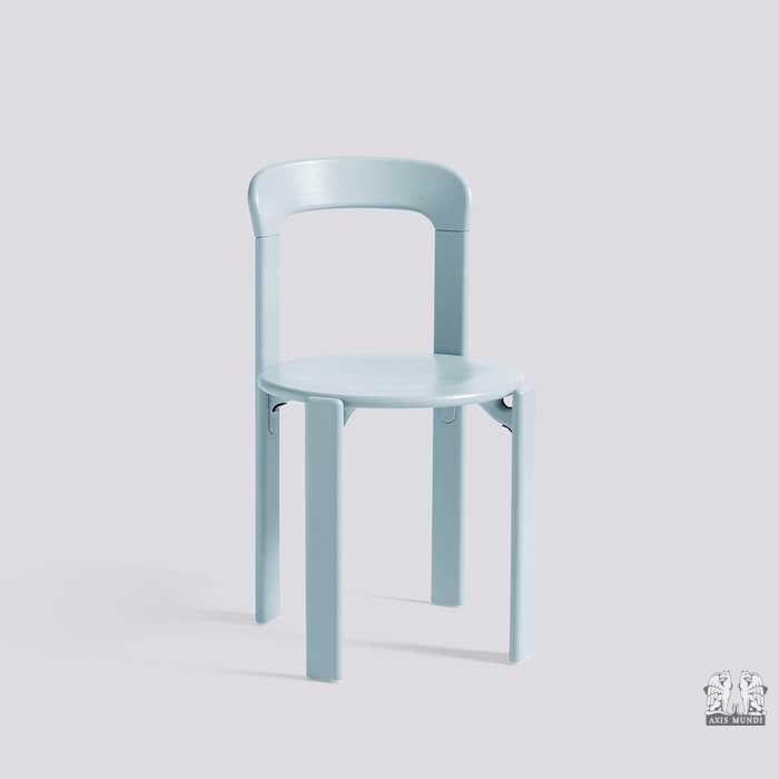 A light blue molded plastic chair with a round seat, four straight legs, and a gently curved backrest connected to the seat by two vertical supports. The design is simple and contemporary. — 3D model