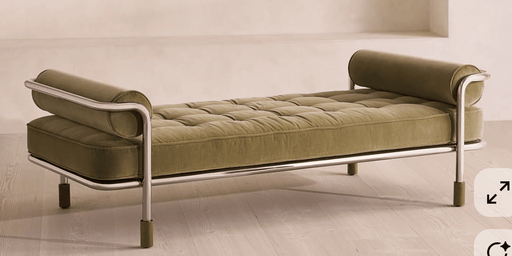 A modern daybed featuring a tufted mattress and cylindrical bolster pillows at either end. The frame… — 3D model