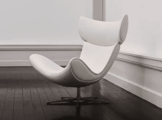 A modern, ergonomic lounge chair with a distinctive high-back design. The chair features a curved se… — free OBJ 3D model