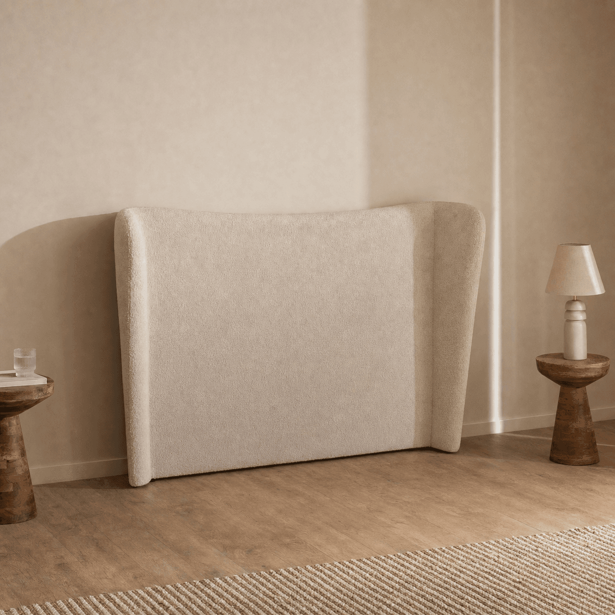 A modern upholstered headboard featuring a wingback design, covered in a textured, light beige fabric. — 3D model