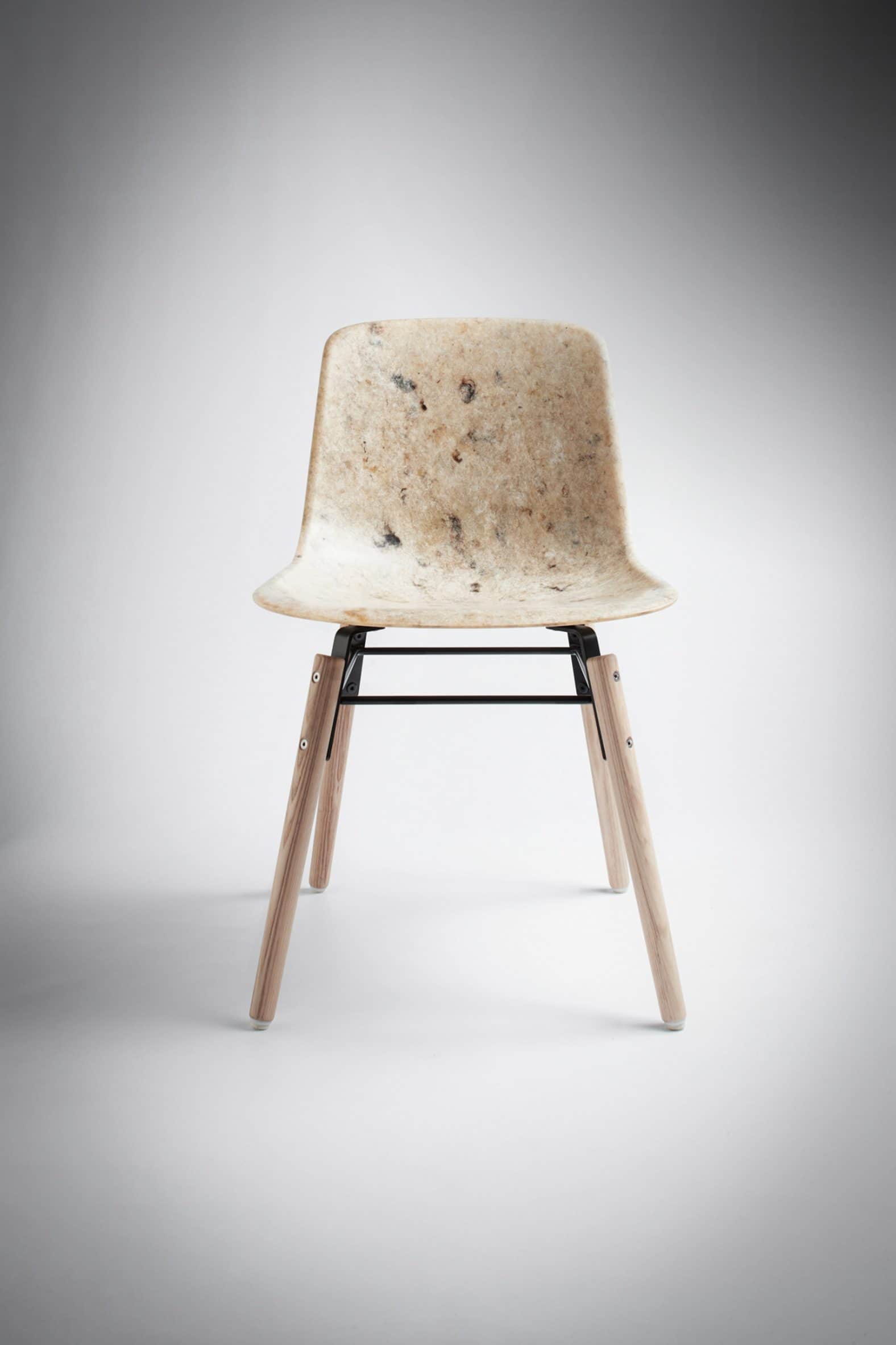 A contemporary side chair featuring a molded shell seat crafted from a light-colored composite mater… — 3D model