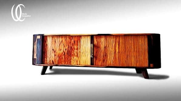 A mid-century modern media console featuring a two-tone wood construction with contrasting light and… — 3D model