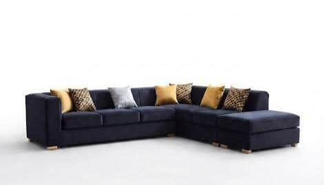 A contemporary L-shaped sectional sofa upholstered in navy blue fabric, featuring an integrated chai… — 3D model