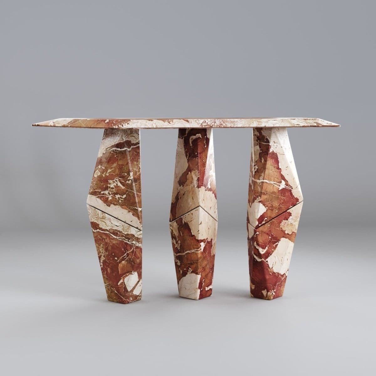 A striking console table featuring a narrow rectangular top supported by three distinct, geometrically faceted legs, all crafted from a richly veined red and white marble. The design is modern and sculptural, with the polygonal forms of the legs creating a dynamic and robust base for the elegant tabletop. — 3D model
