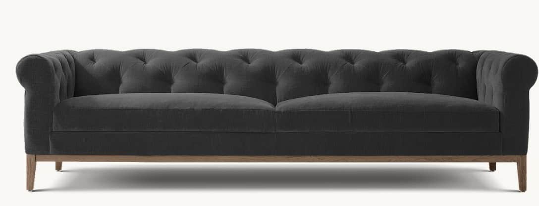 A three-seater sofa with a tufted backrest and rolled arms. The sofa features a low-profile wooden b… — free GLTF 3D model