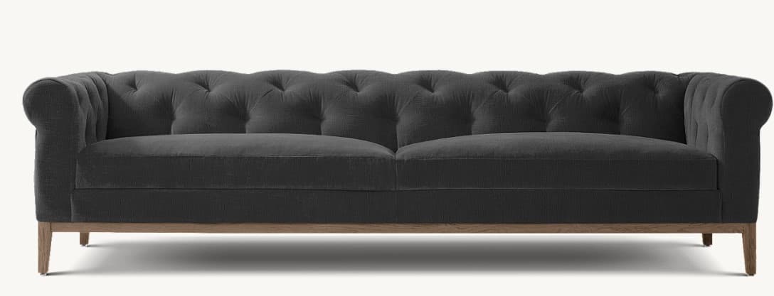 A three-seater sofa with a tufted backrest and rolled arms. The sofa features a low-profile wooden base with four tapered legs. The upholstery appears to be a textured fabric. — 3D model