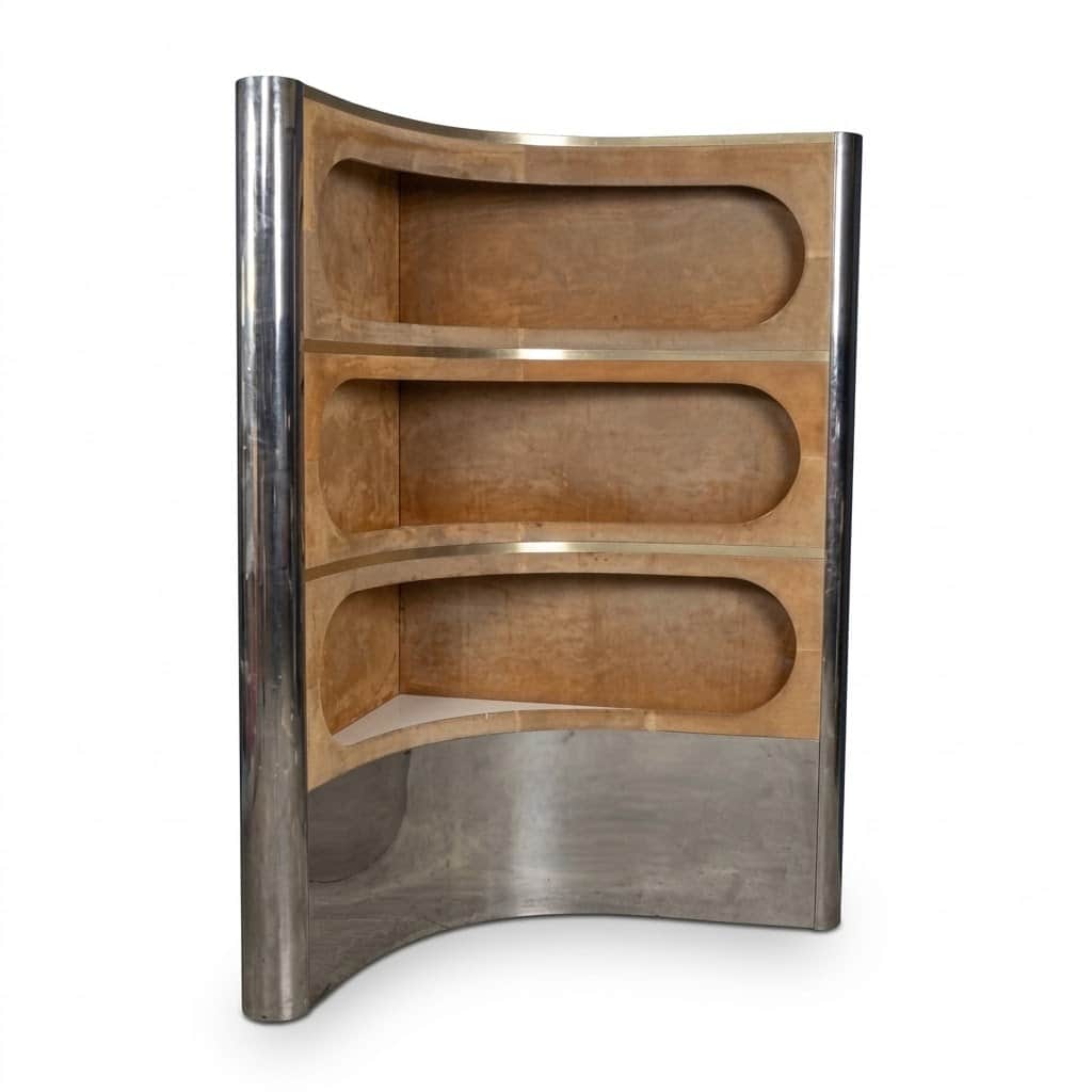 A freestanding, curved display cabinet featuring a polished chrome or stainless steel exterior and a… — 3D model