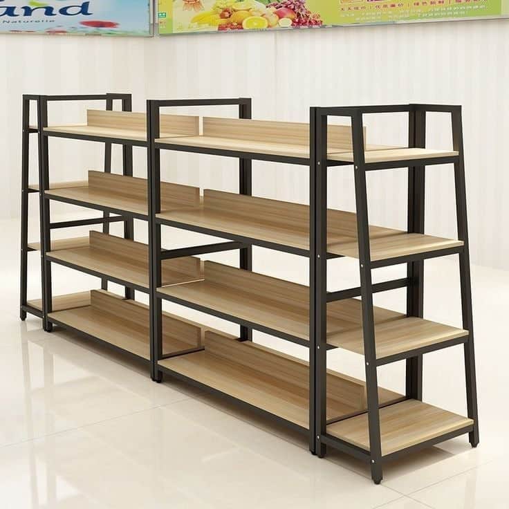 A multi-bay shelving unit featuring a dark, possibly black, metal frame and light wood-grain finishe… — 3D model