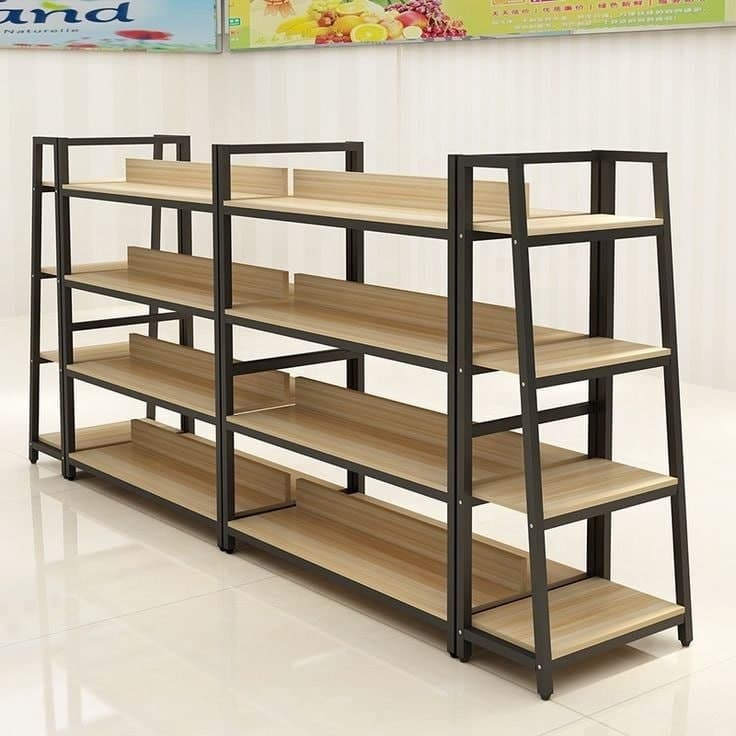 A multi-bay shelving unit featuring a dark, possibly black, metal frame and light wood-grain finished shelves. The unit consists of at least two connected bays, each with four tiers of shelves. Some shelves include a short vertical back panel or lip, suggesting a design intended for organization or display to prevent items from falling off. The overall aesthetic is clean and industrial-contemporary. — 3D model