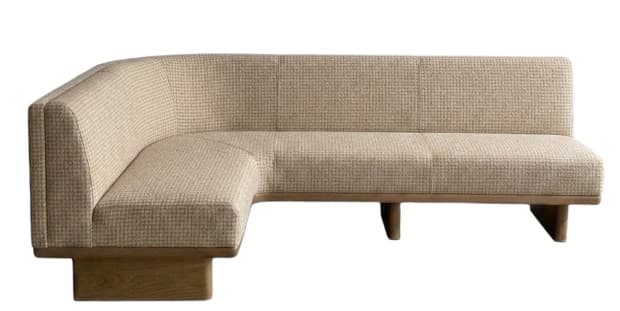 A left-hand facing sectional sofa with a curved corner. The sofa features a textured, neutral-toned upholstery and a low-profile wooden base with tapered legs. The back cushions are segmented with stitching, and the seat appears to be a single continuous piece. — 3D model