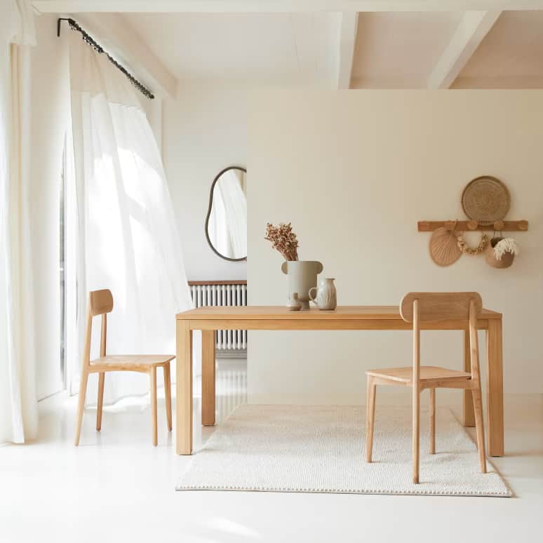 An image displaying a simple, modern dining table crafted from light-toned wood, accompanied by a si… — 3D model