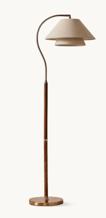 A floor lamp with a curved metal arm extending from a wooden pole, supporting a two-tiered conical lampshade. The base is circular and made of metal. The overall design appears to be modern or transitional. — 3D model