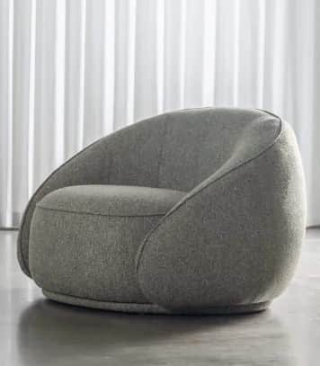 A contemporary lounge chair featuring a soft, rounded, and inviting silhouette, fully upholstered in… — 3D model
