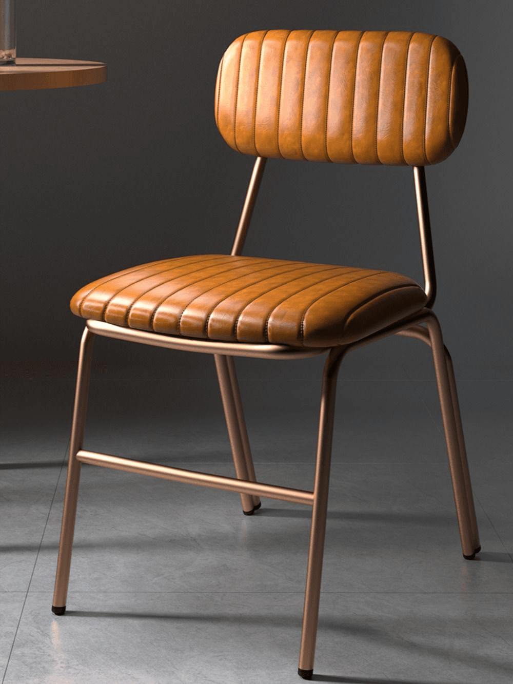 A contemporary dining chair featuring a slender, rose gold-toned metal frame and channel-tufted tan faux leather upholstery. The seat and backrest are both padded and vertically stitched, providing a distinct textured appearance. The chair has a minimalist profile with four splayed legs and a simple support structure for the backrest. — 3D model