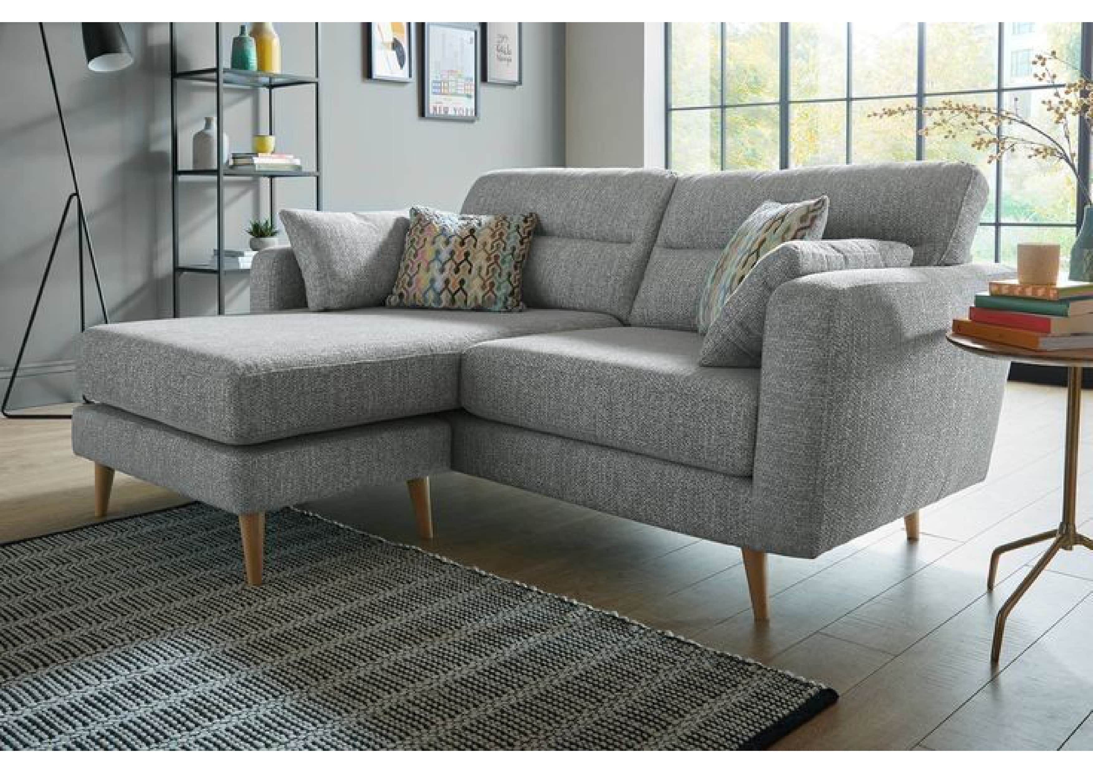 A modern sectional sofa upholstered in light grey fabric, featuring a left-hand chaise extension, su… — free SKP 3D model