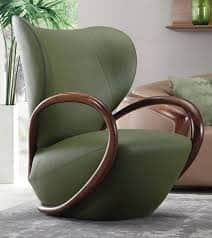 A stylish lounge chair featuring a high, curved back and an ergonomic seat, all upholstered in a mat… — 3D model