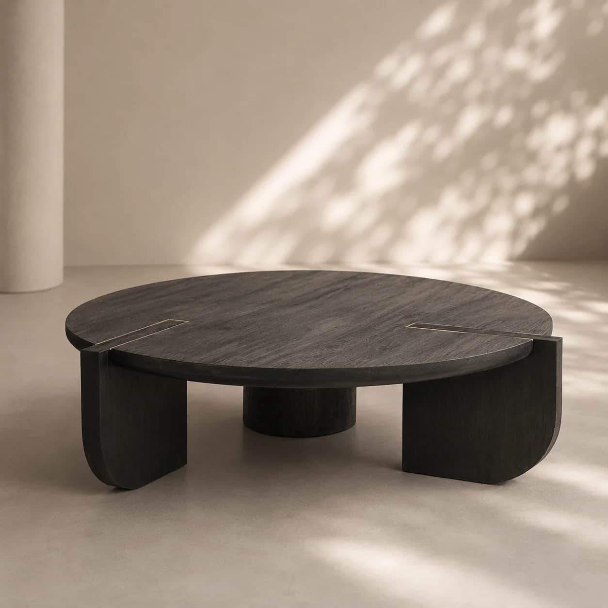 A contemporary round coffee table featuring a dark, possibly ebony-stained wood finish with visible… — 3D model