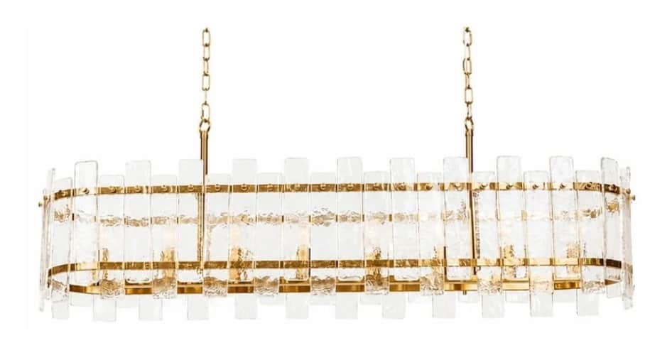An oval-shaped chandelier featuring a polished brass frame adorned with multiple vertical textured g… — 3D model