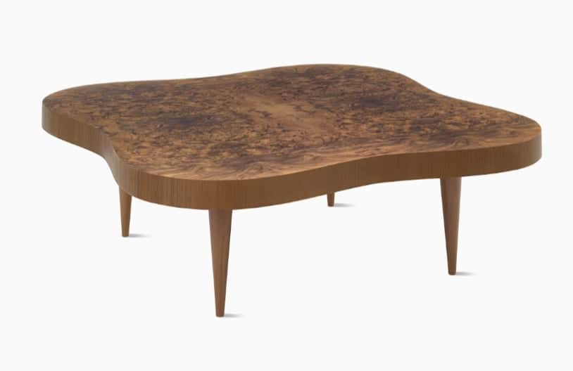 A low-profile coffee table featuring an organically shaped tabletop with a distinct burl wood veneer… — 3D model