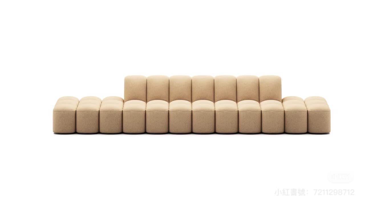 A contemporary modular sectional sofa composed of multiple individual, rounded block-like segments. The sofa features a low-profile silhouette with distinct seat and backrest components, all upholstered in a textured beige fabric. — 3D model