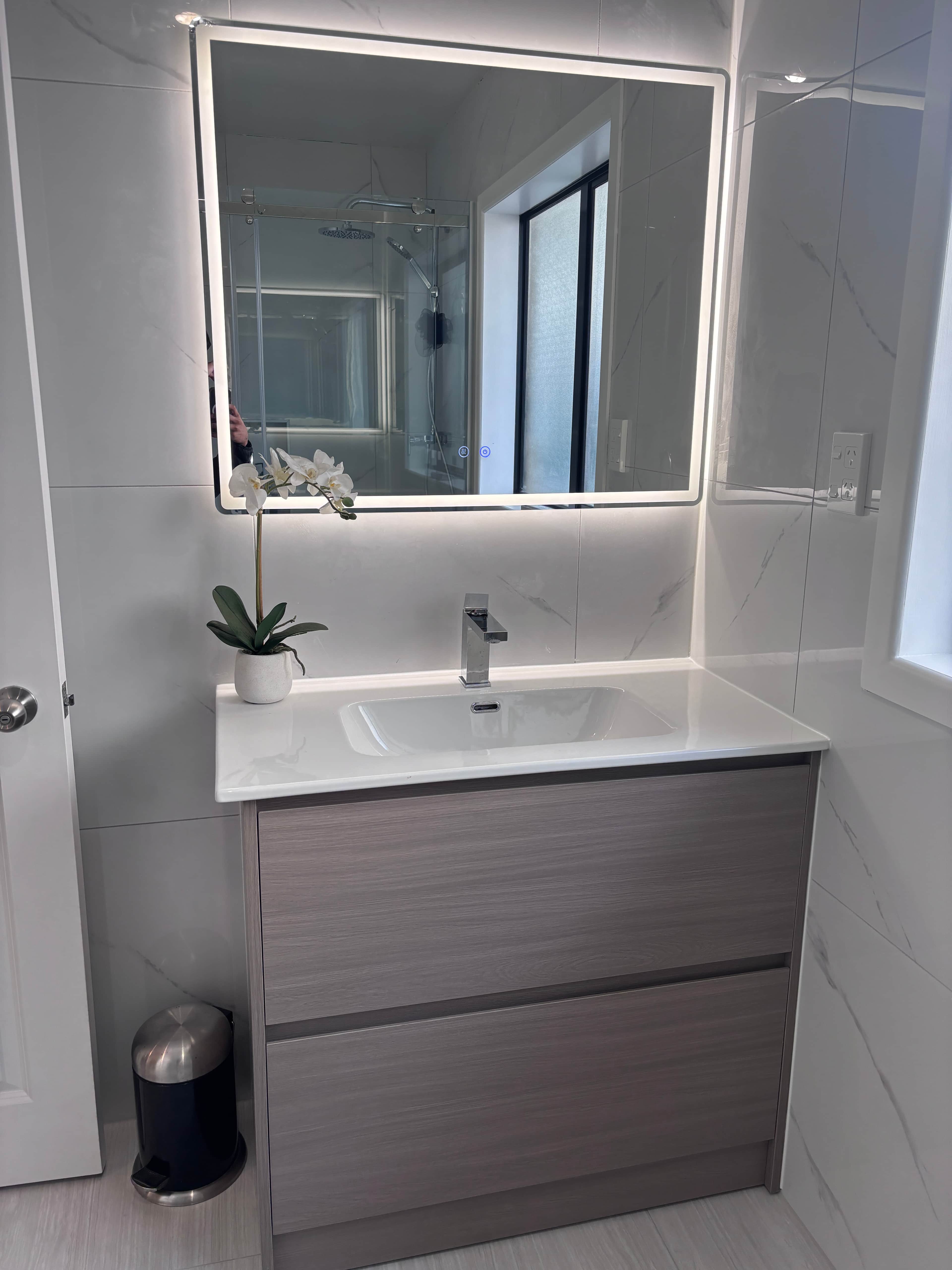 A modern wall-mounted bathroom vanity unit featuring a rectangular white integrated sink and counter… — free OBJ 3D model