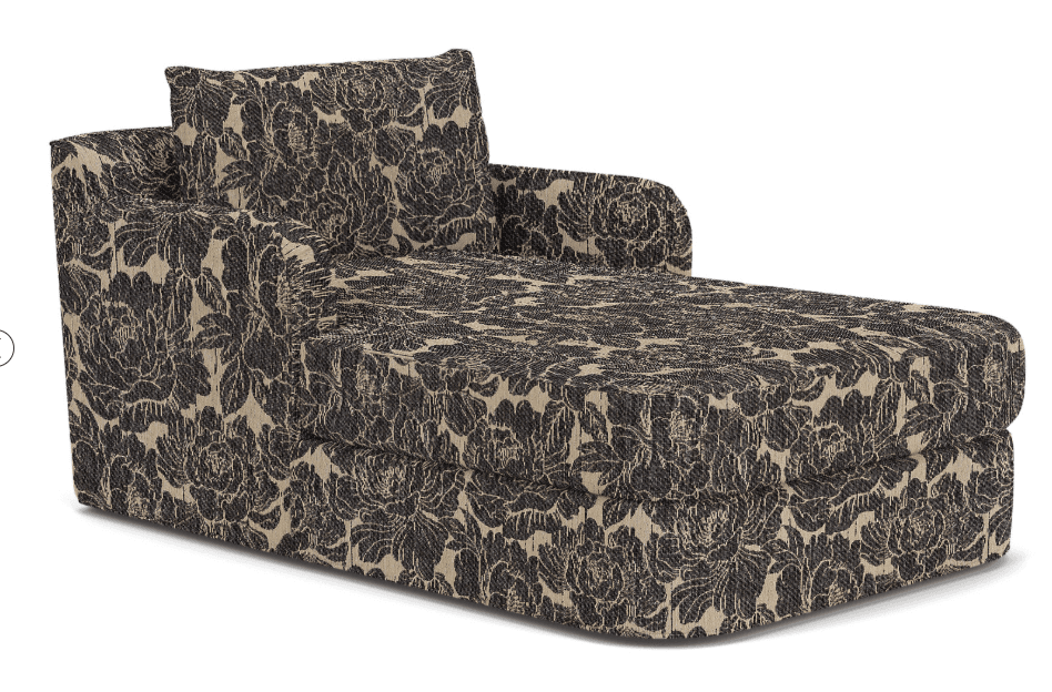 A contemporary chaise lounge upholstered in a dark floral pattern on a light beige background, featuring a single armrest and a loose back cushion. — 3D model