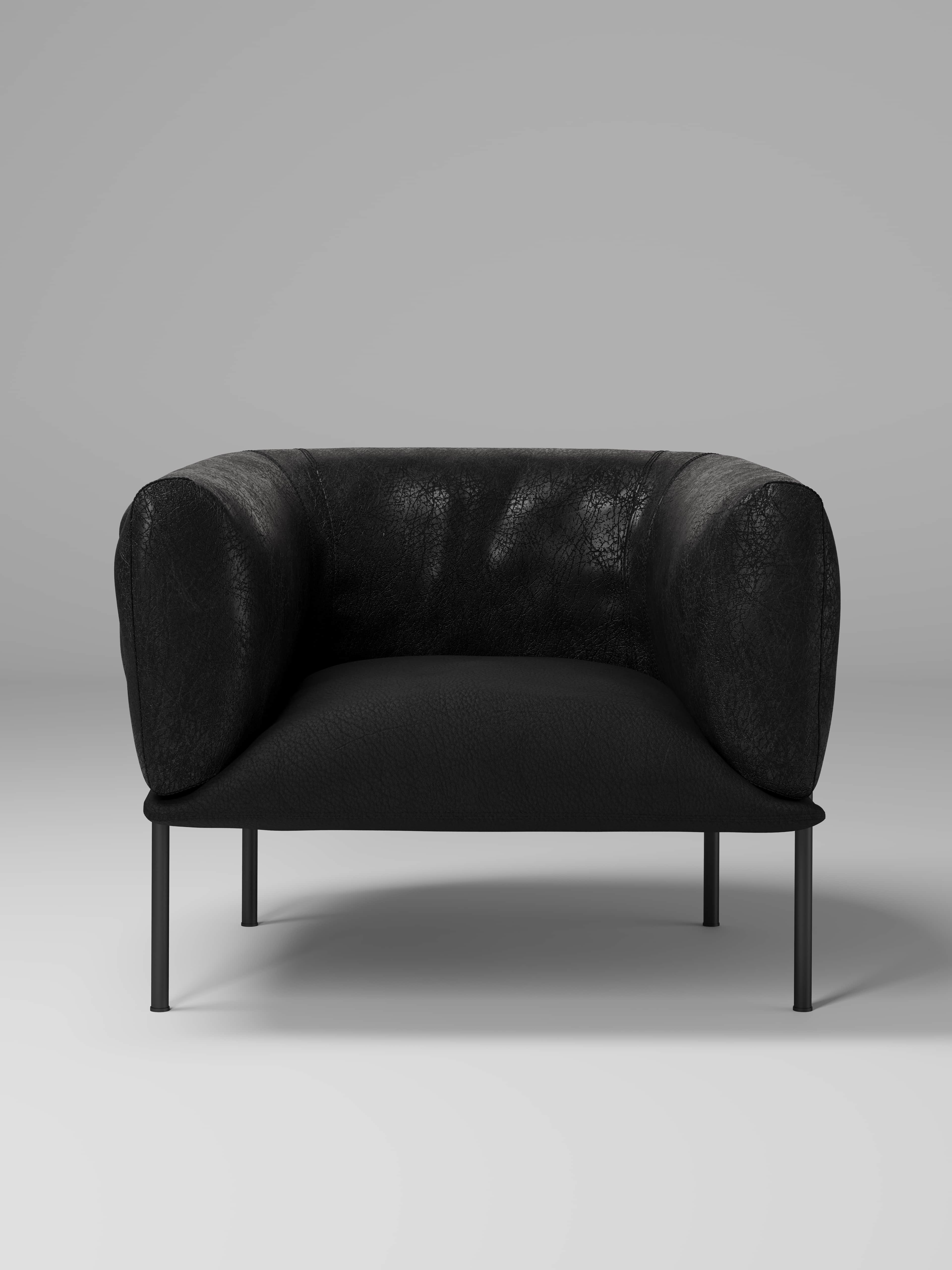A contemporary armchair with a low profile, featuring a rounded, enveloping back and armrests. The u… — free OBJ 3D model