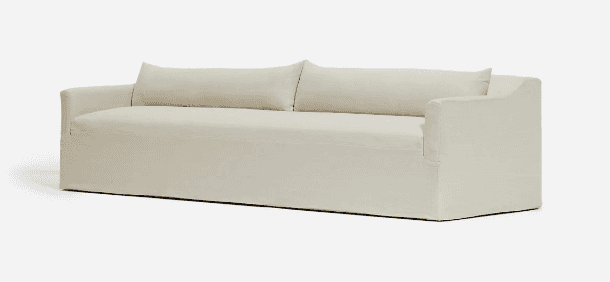 A contemporary sofa featuring an ecru-colored slipcover that gives it a relaxed and casual appearanc… — free BLEND 3D model