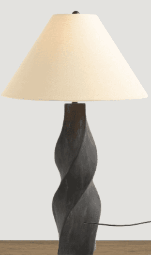 A table lamp featuring a dark, twisted column-shaped base and a conical, off-white fabric shade. The… — 3D model