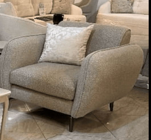 A modern upholstered armchair featuring soft, rounded lines and a light beige or greige textured fab… — free OBJ 3D model