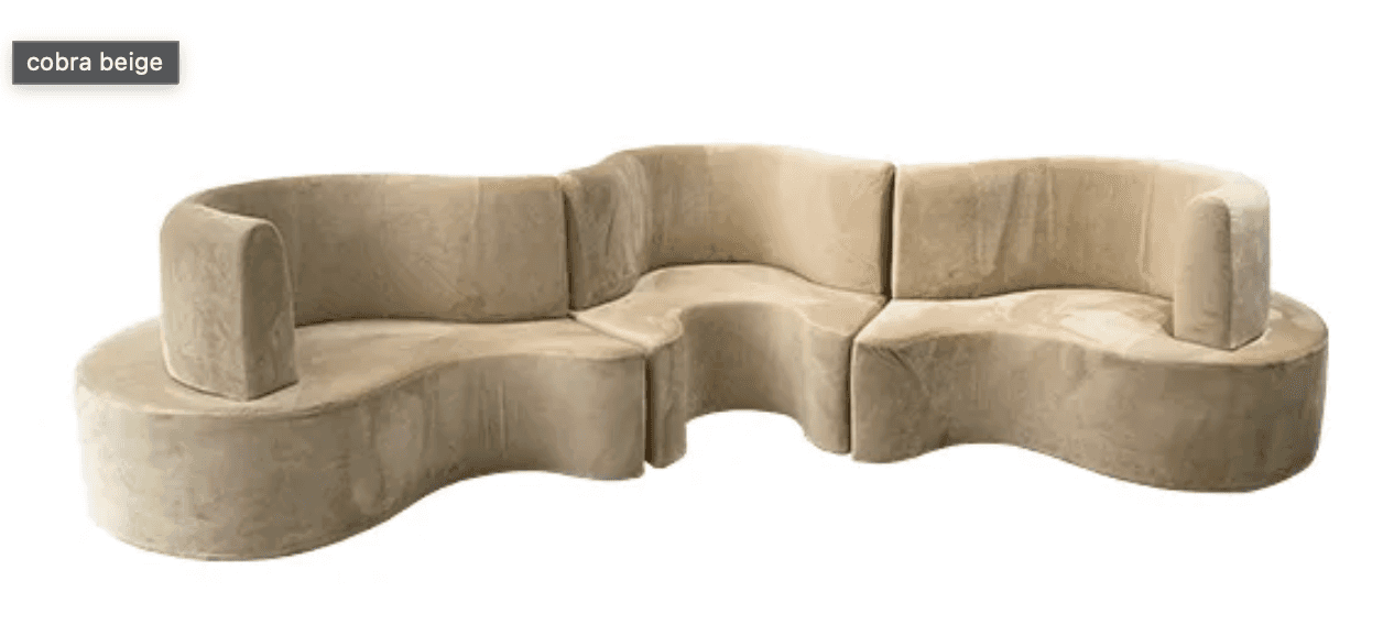 A modular, curved sofa with a sinuous, organic form. It appears to be upholstered in a soft, plush f… — 3D model
