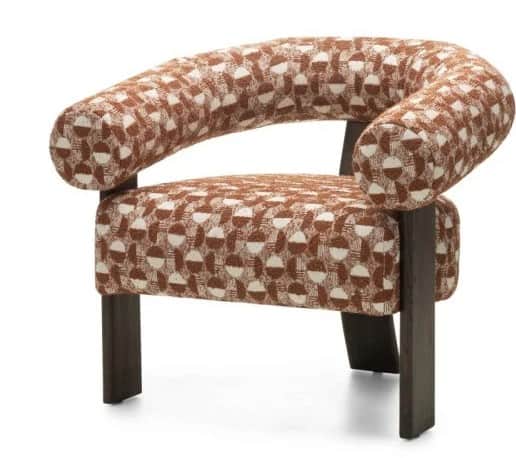 A contemporary armchair featuring a curved, padded backrest that extends into armrests. The seat is… — 3D model