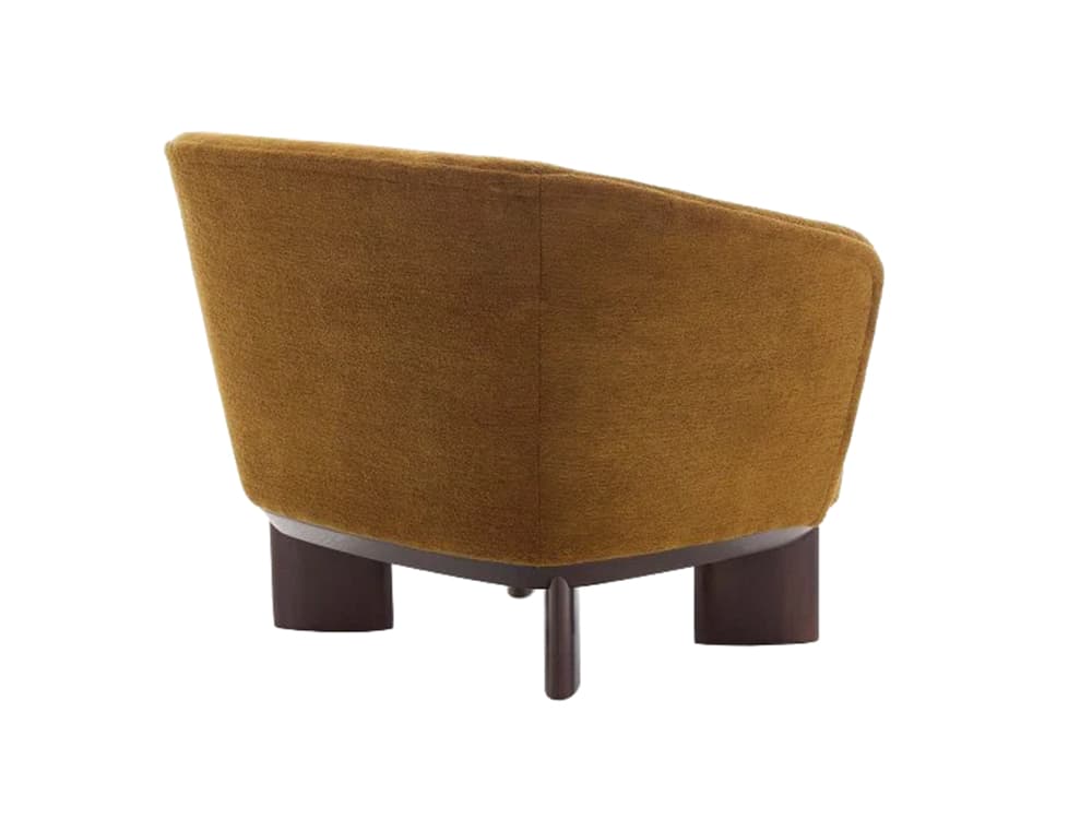 A compact upholstered lounge chair featuring a rounded, low-profile silhouette. The chair is covered in a textured, mustard yellow fabric and rests on short, dark brown wooden legs. The back and armrests are integrated, creating a seamless, enveloping form. The design appears modern with a touch of classic comfort, ideal for accent seating. — 3D model