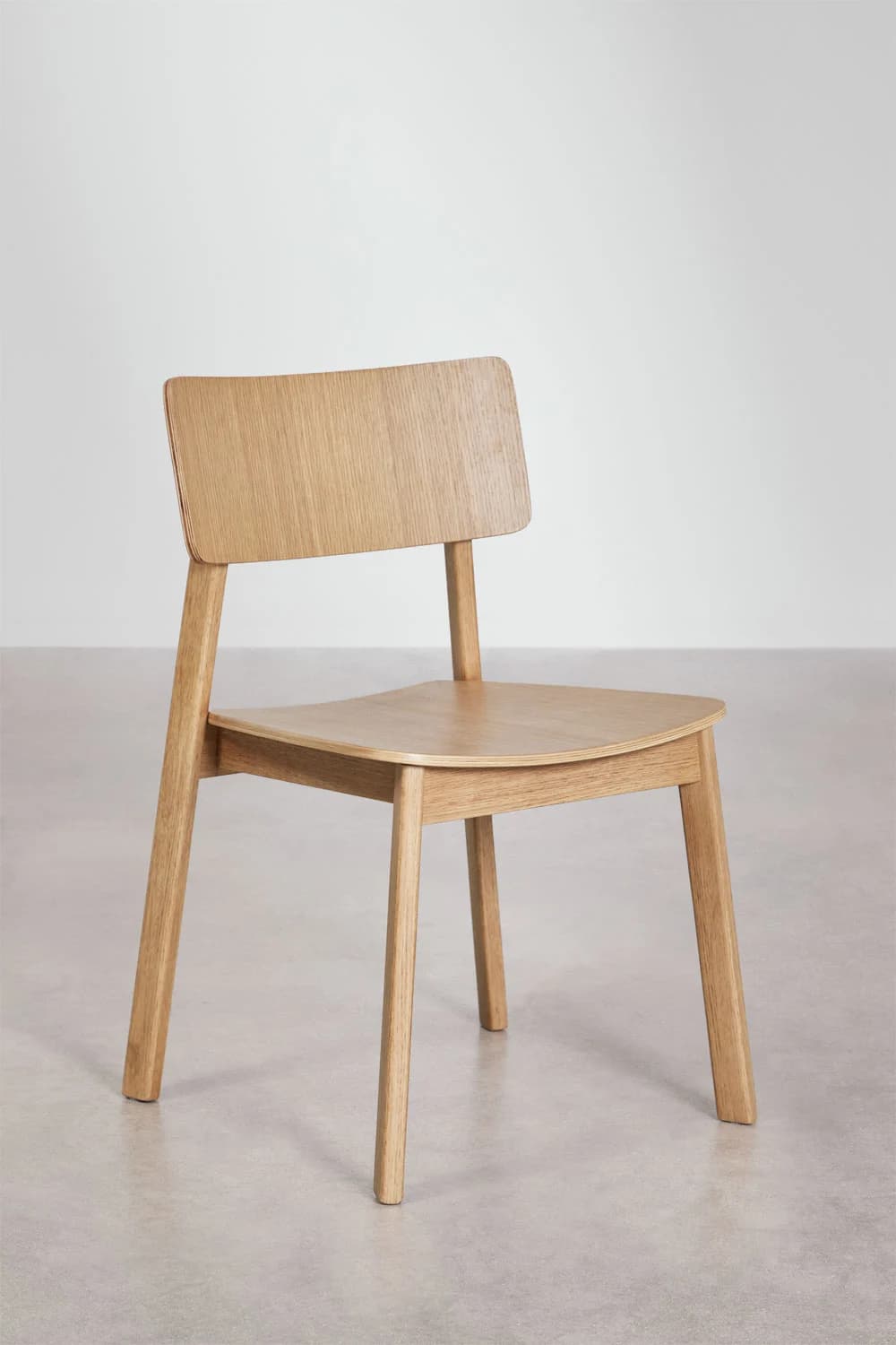 A minimalist dining chair crafted from light-toned natural wood, featuring a simple, clean-lined design with a gently curved seat and backrest. — 3D model