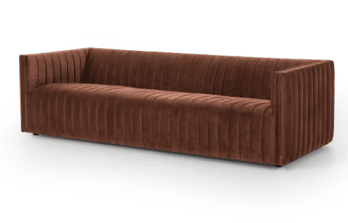 A long, three-seater sofa with a channel-tufted design covering the seat, back, and armrests. The sofa has a modern, minimalist aesthetic with a straight back and armrests that form a continuous line with the seat. — 3D model
