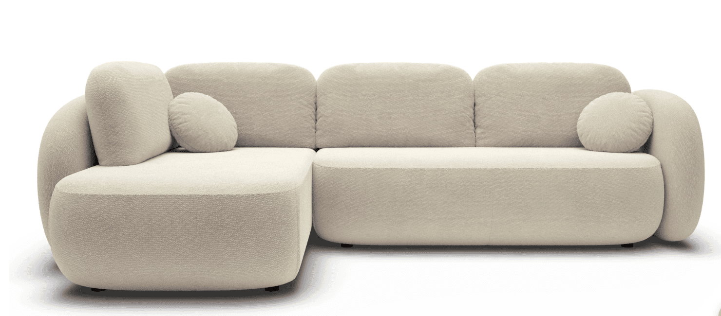 An L-shaped sectional sofa featuring a modern, plush design with rounded edges and soft, voluminous forms. It is upholstered in a light-colored, textured bouclé fabric and includes separate back cushions and two cylindrical accent pillows. — 3D model